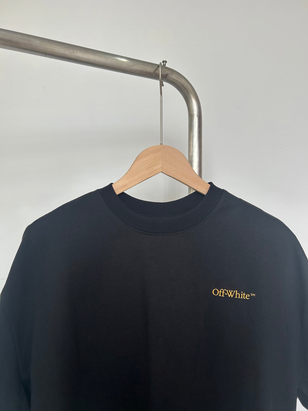 Black Off-White T-shirt with small chest logo near crew neckline