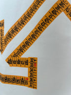 Off-White off-white T-shirt close-up of orange measurement logo lines and numbers