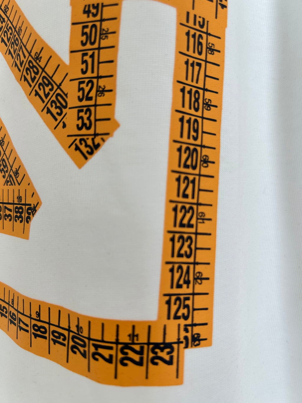 Off-White off-white T-shirt close-up of orange curved logo print with numbers