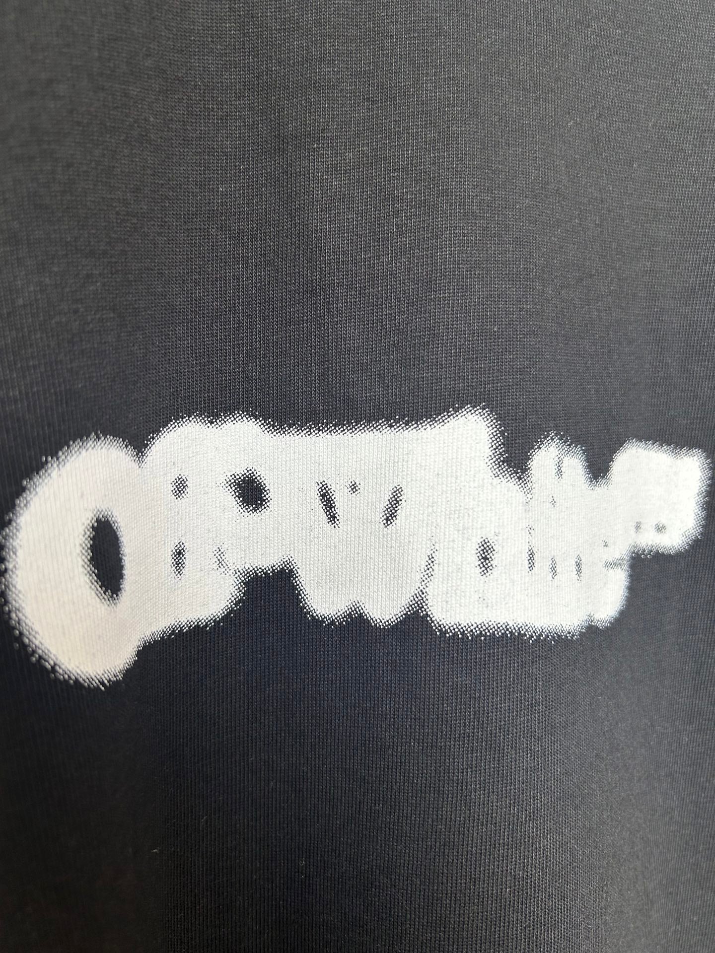 Black T-shirt fabric with off-white distressed logo detail
