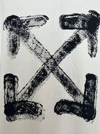 Off-white T-shirt with large black X-shaped logo print, textured ink