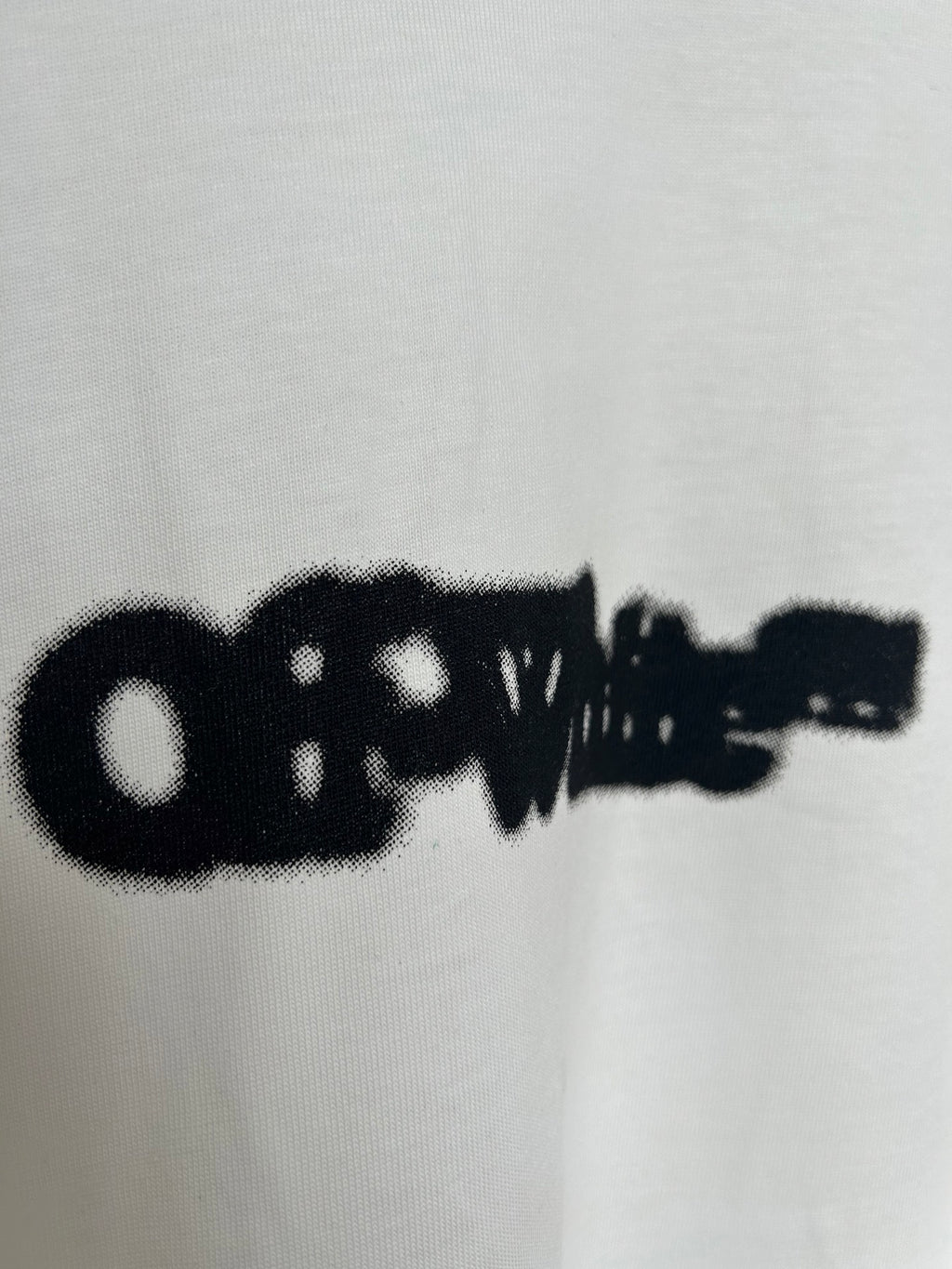 Off-white T-shirt close-up of black printed logo details