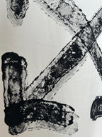 Off-white T-shirt close-up of black logo letter strokes
