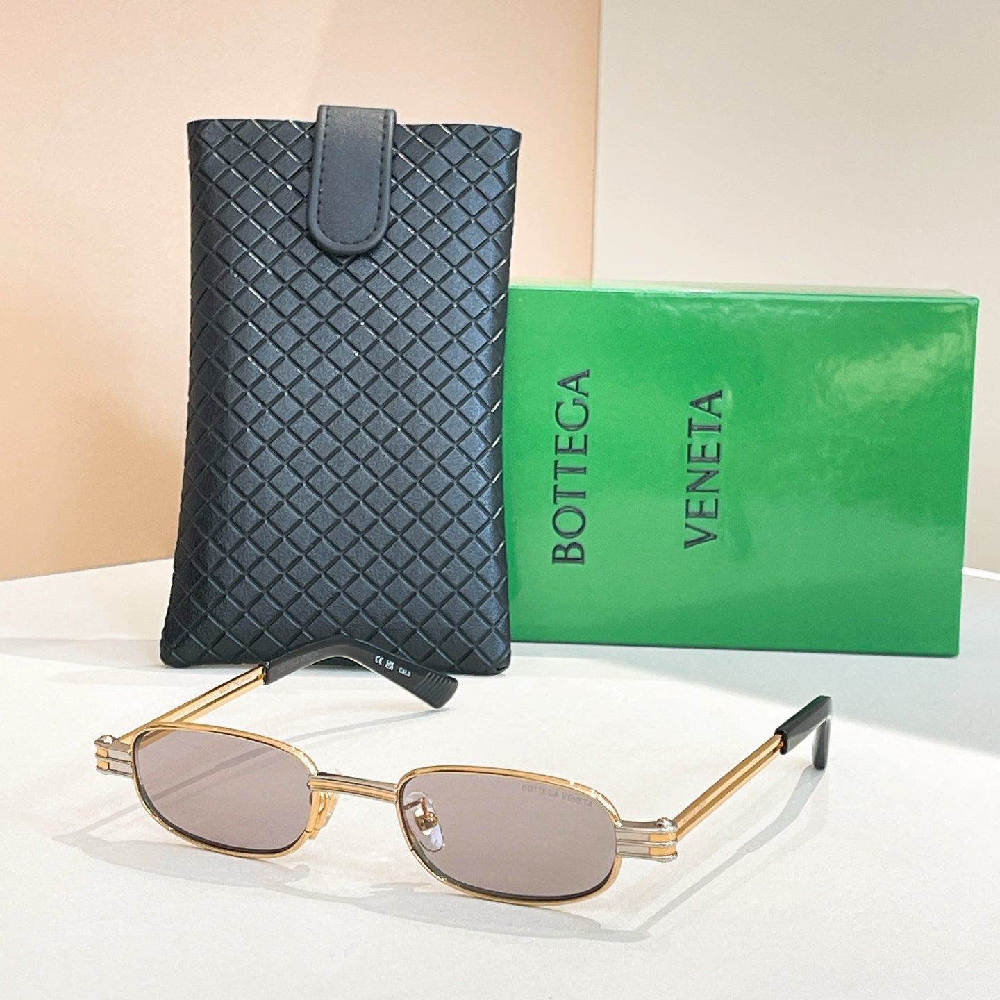 Bottega Veneta oval sunglasses, gold frame with light brown lenses