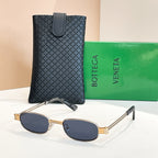 Bottega Veneta oval sunglasses, gold frame with dark lenses
