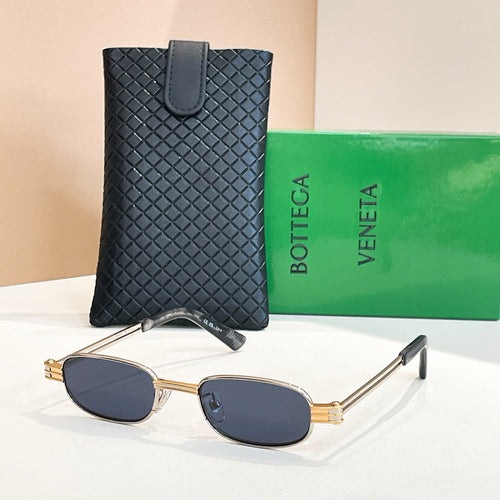 Bottega Veneta oval sunglasses, gold frame with dark lenses