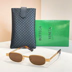 Bottega Veneta oval sunglasses, gold frame with dark brown lenses