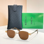 Bottega Veneta sunglasses with warm brown lenses, gold-tone round frame and arms.