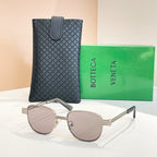 Bottega Veneta sunglasses with light gray lenses, silver-tone round frame and arms.