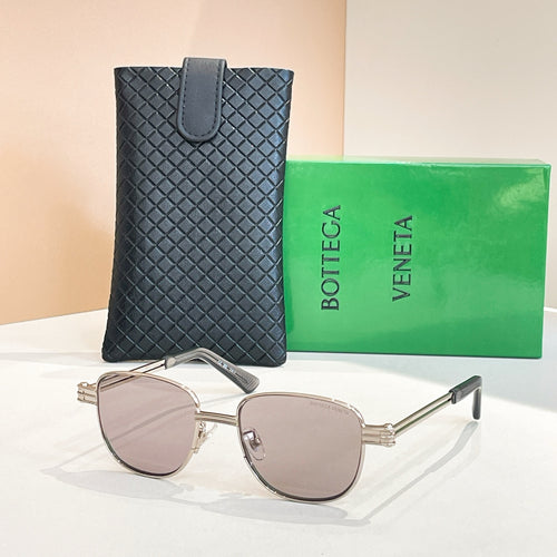 Bottega Veneta sunglasses with light gray lenses, silver-tone round frame and arms.