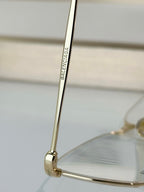 Balenciaga glasses close-up of gold temple arm with logo