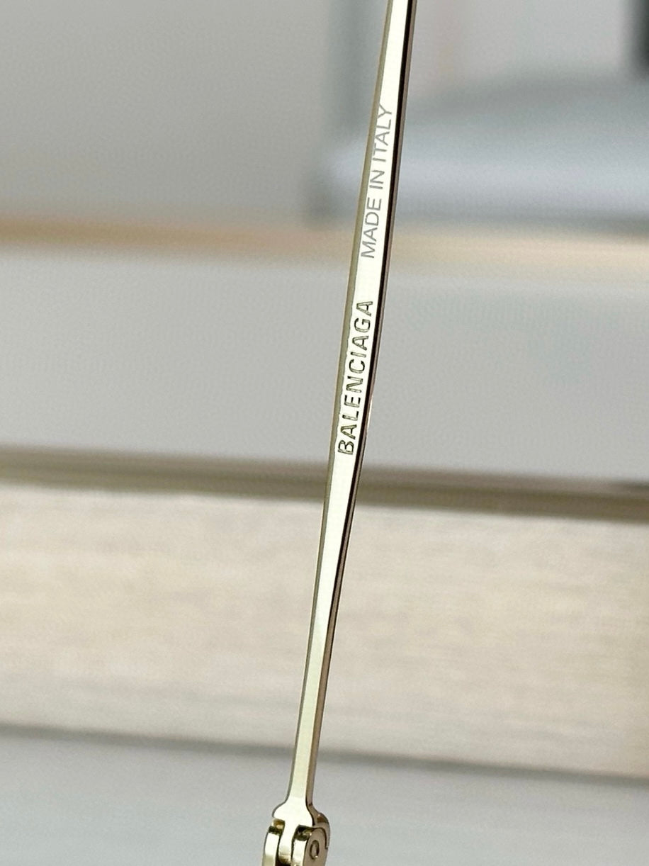 Balenciaga glasses close-up of gold temple arm with Made in Italy text