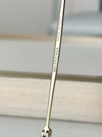 Balenciaga glasses close-up of gold temple arm with Made in Italy text