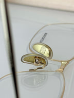 Balenciaga glasses close-up of nose bridge and logo on clear lens rim