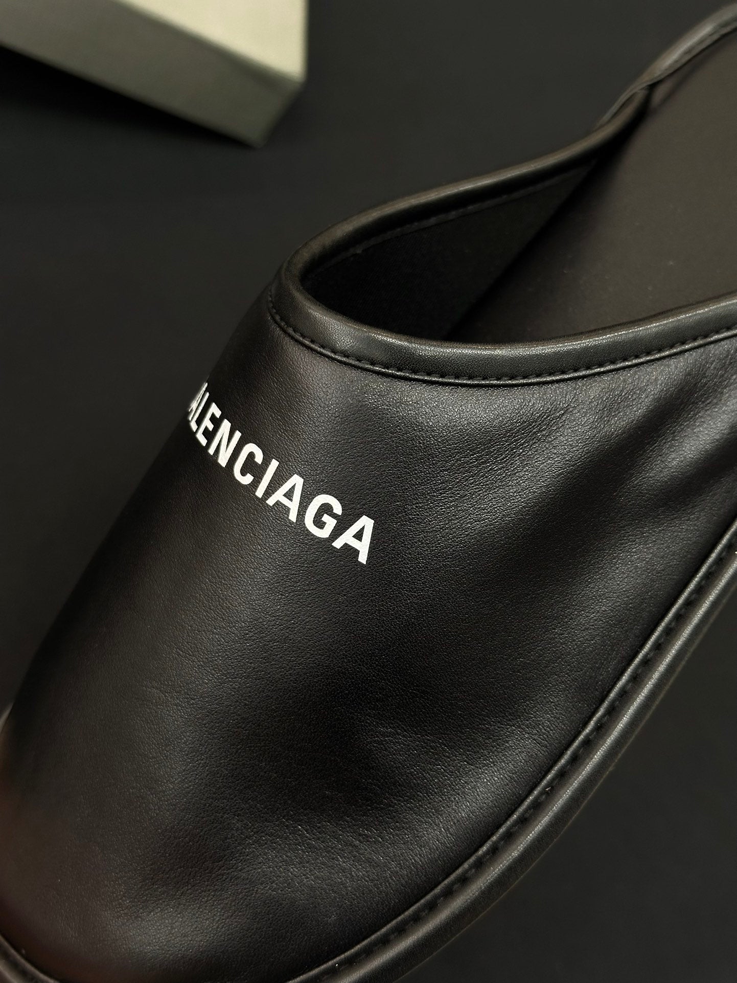 Black leather slide upper with BALENCIAGA logo on side panel
