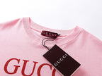 Pink T-shirt neckline with Gucci label and red logo print, with tag attached
