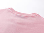 Pink crew-neck T-shirt collar and neckline seam detail