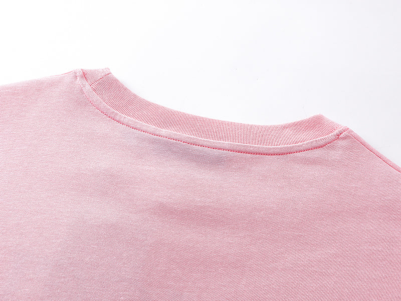 Pink crew-neck T-shirt collar and neckline seam detail
