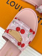 Cherry-print slide sandals with gold-tone buckle on pink cushioned footbed