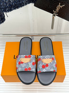 Women’s slide sandals, pair: gray footbed and blue cherry-print denim slide straps