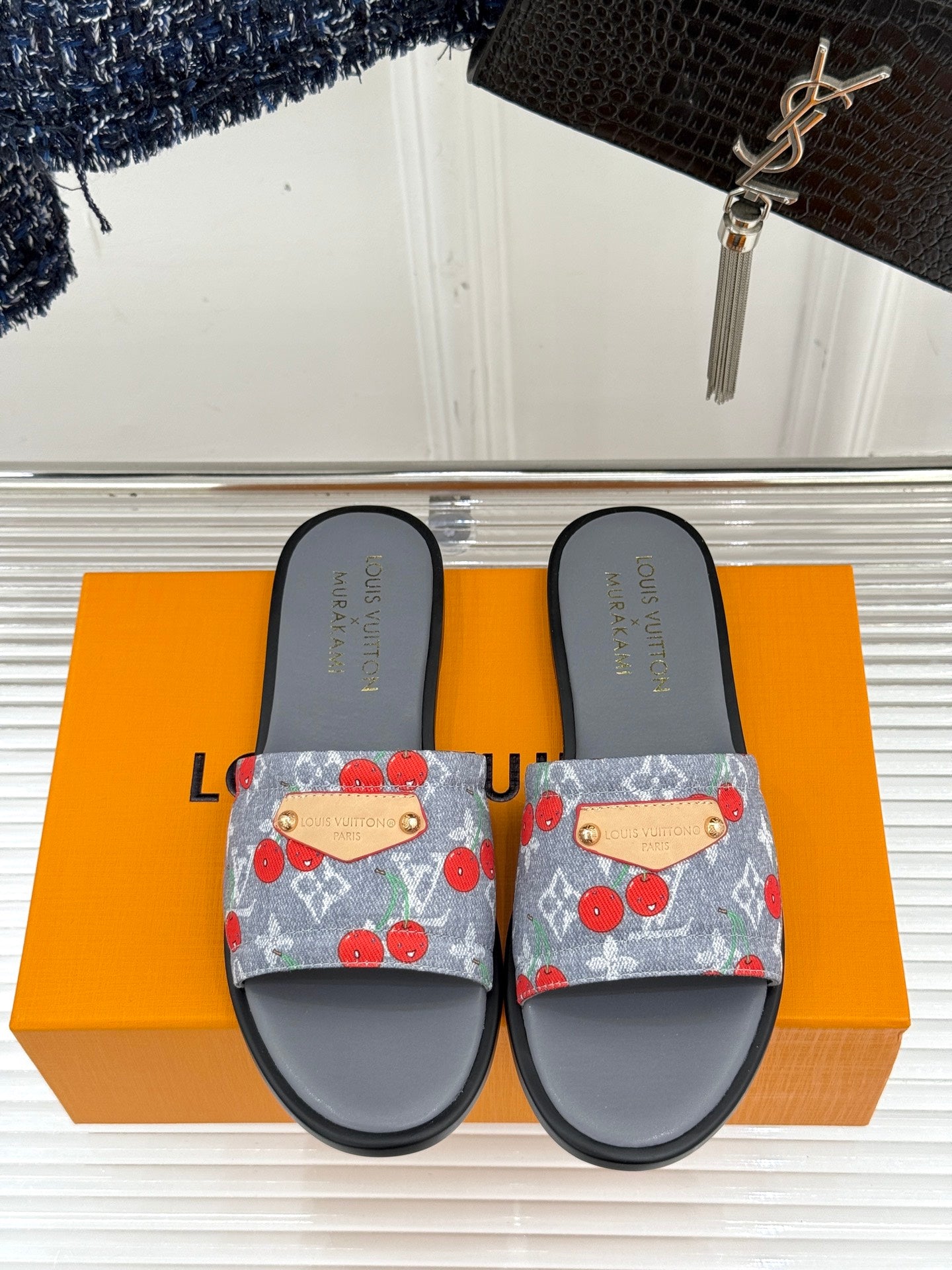 Women’s slide sandals, pair: gray footbed and blue cherry-print denim slide straps