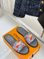 Women’s slide sandals on orange box, gray sole with cherry-print denim straps