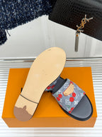 Women’s slide sandals, single pair view: blue cherry-print strap on gray sole