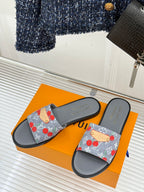 Women’s slide sandals, pair shown: gray footbed with cherry-print denim straps