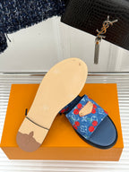 Louis Vuitton denim slide sandal showing beige outsole and blue cherry-print strap