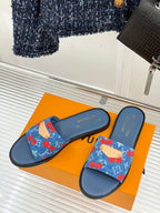Louis Vuitton slide sandals on box, blue denim straps with red cherries and navy soles