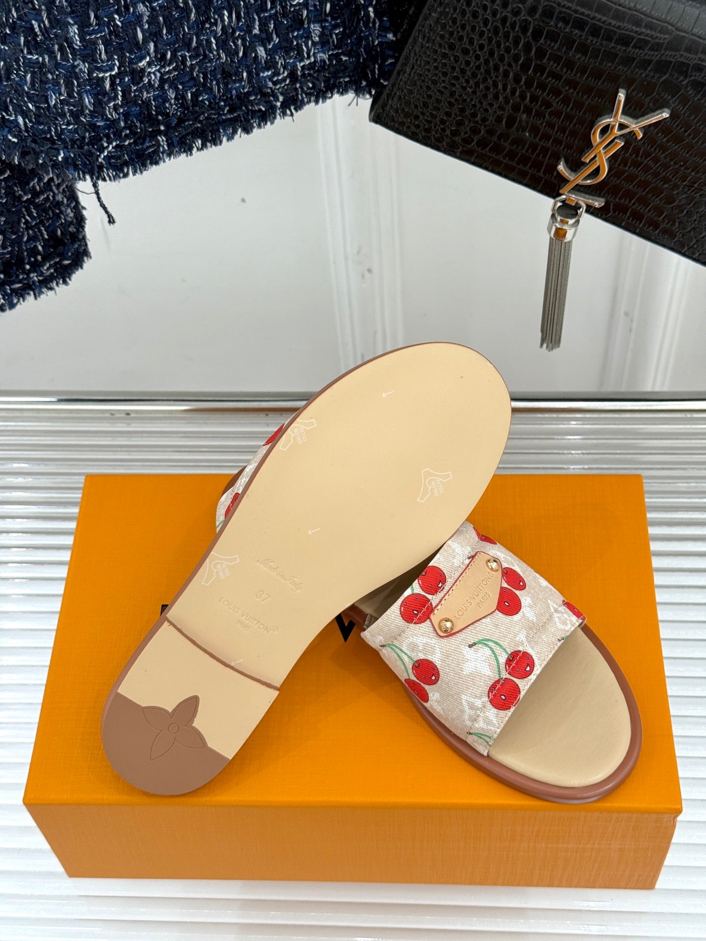 Louis Vuitton cherry-print slide sandal with tan sole and beige footbed, single