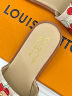Louis Vuitton slide sandal footbed with gold logo and cherry-pattern strap