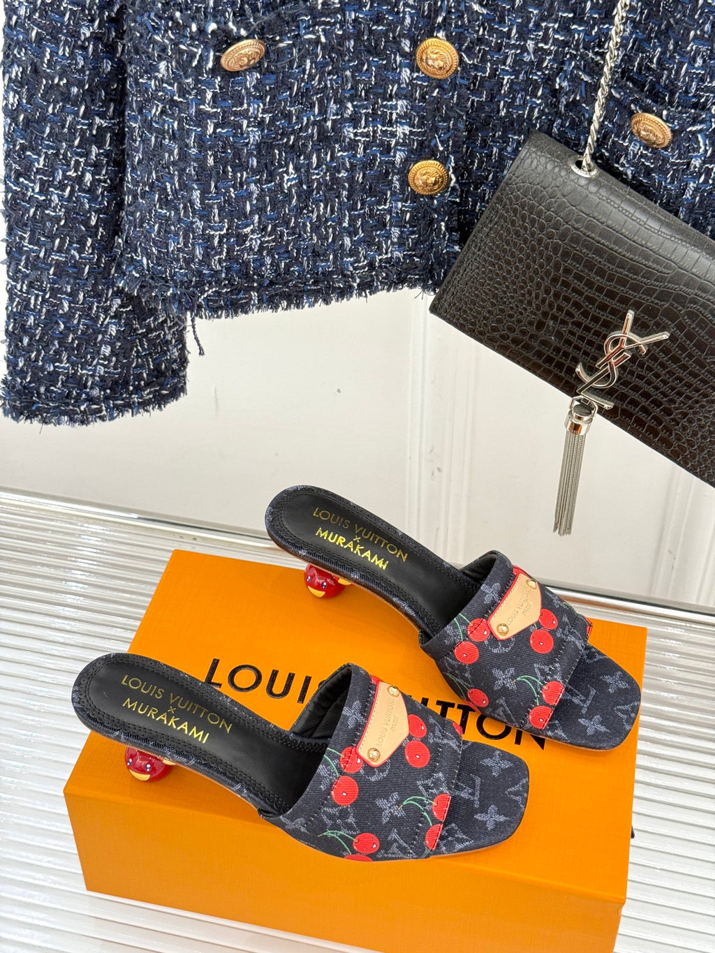 Women’s Louis Vuitton cherry print slip-on mules with black straps and low heel
