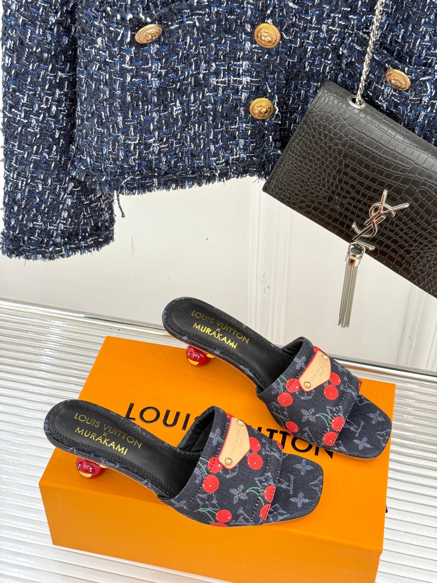 Women’s Louis Vuitton cherry print slip-on mules with black straps and low heel