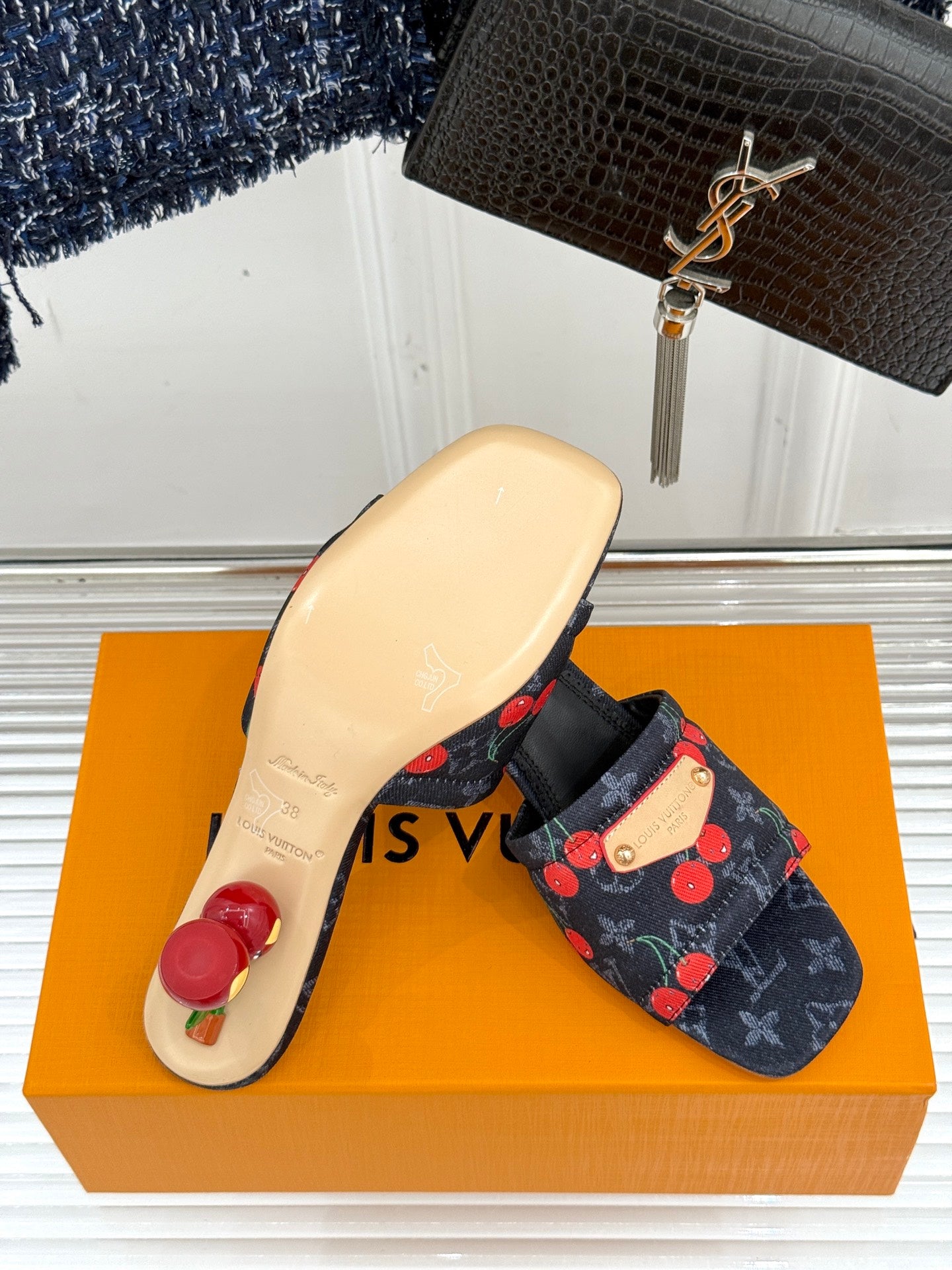 Women’s Louis Vuitton cherry print slide mules with beige outsole and black straps