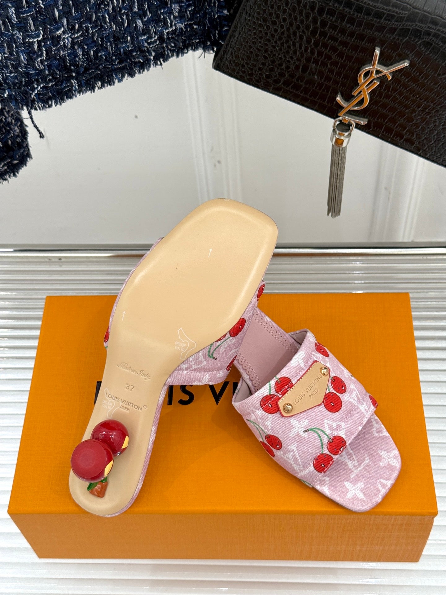 Pink cherry-print Louis Vuitton slide sandal with pale beige outsole