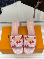 Pink cherry-print Louis Vuitton mule sandals with fabric straps and stitched edging