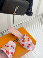Pink cherry-print Louis Vuitton slide sandal with textured pink strap and gold detail