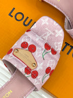 Pink cherry-print Louis Vuitton sandal strap with gold buckle plate and stitching