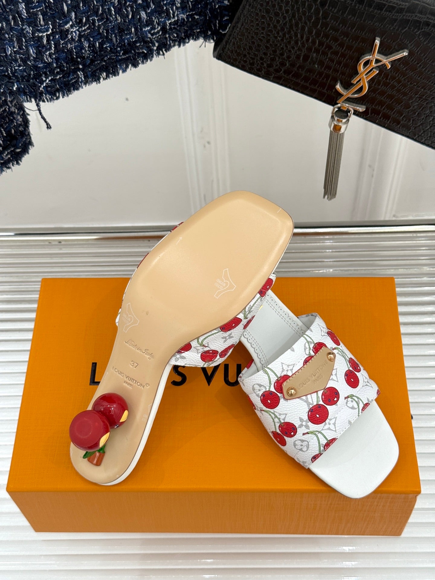 Louis Vuitton women's white cherry-print slide sandals with textured sole and gold buckle