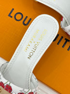 Louis Vuitton women's white leather slide sandal with embroidered-style logo on footbed