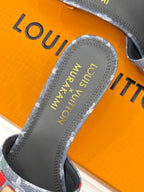 Louis Vuitton gray slide sandal sole and logo, cherry-print upper close view