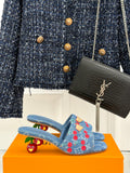 Louis Vuitton blue denim mules with red cherry pattern and gold buckle detail