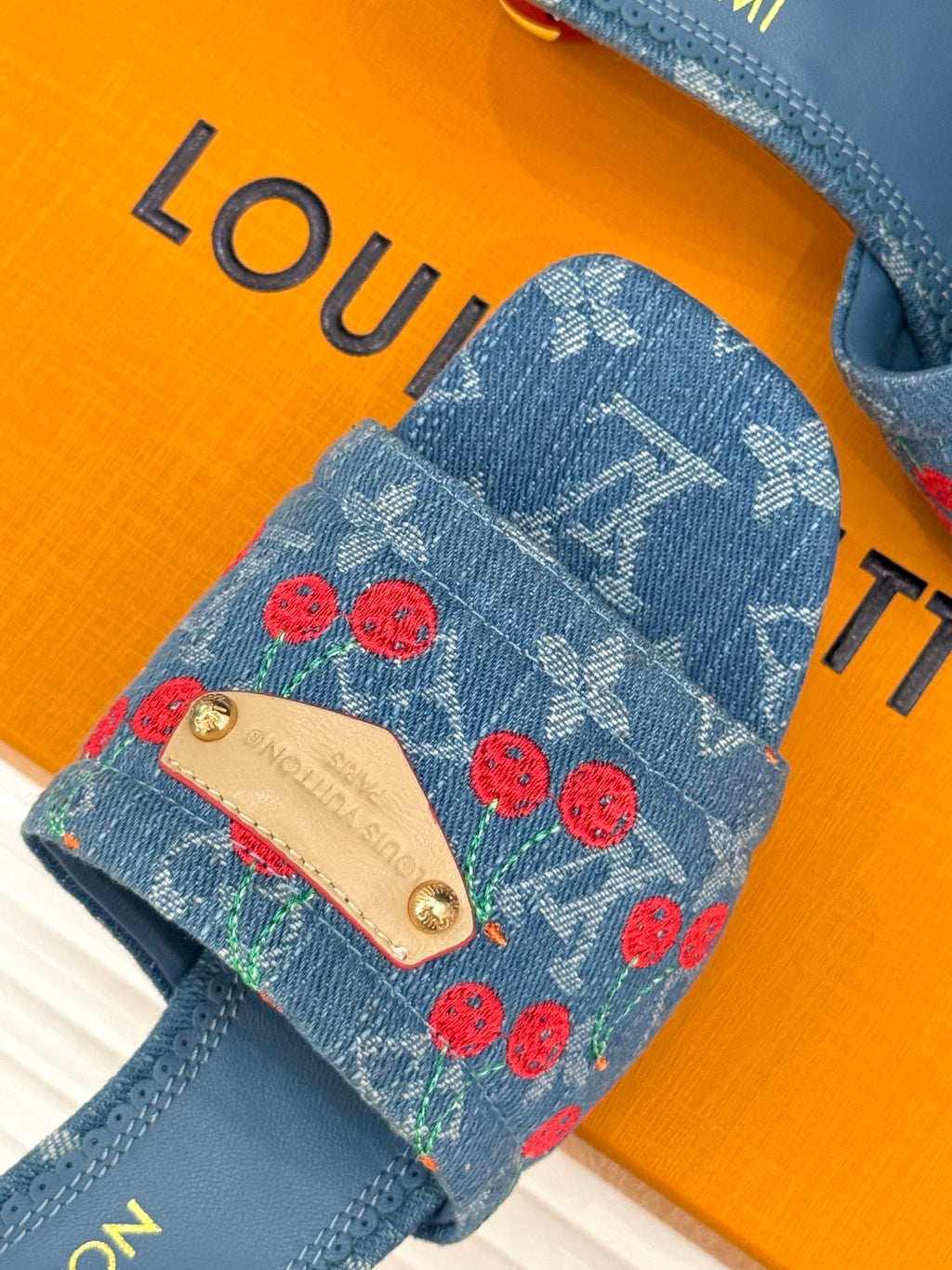 Louis Vuitton blue denim mule upper with red cherries and beige leather patch