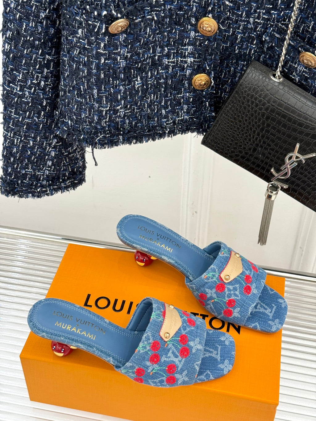 Louis Vuitton blue denim mules with red cherry motif and gold buckled strap