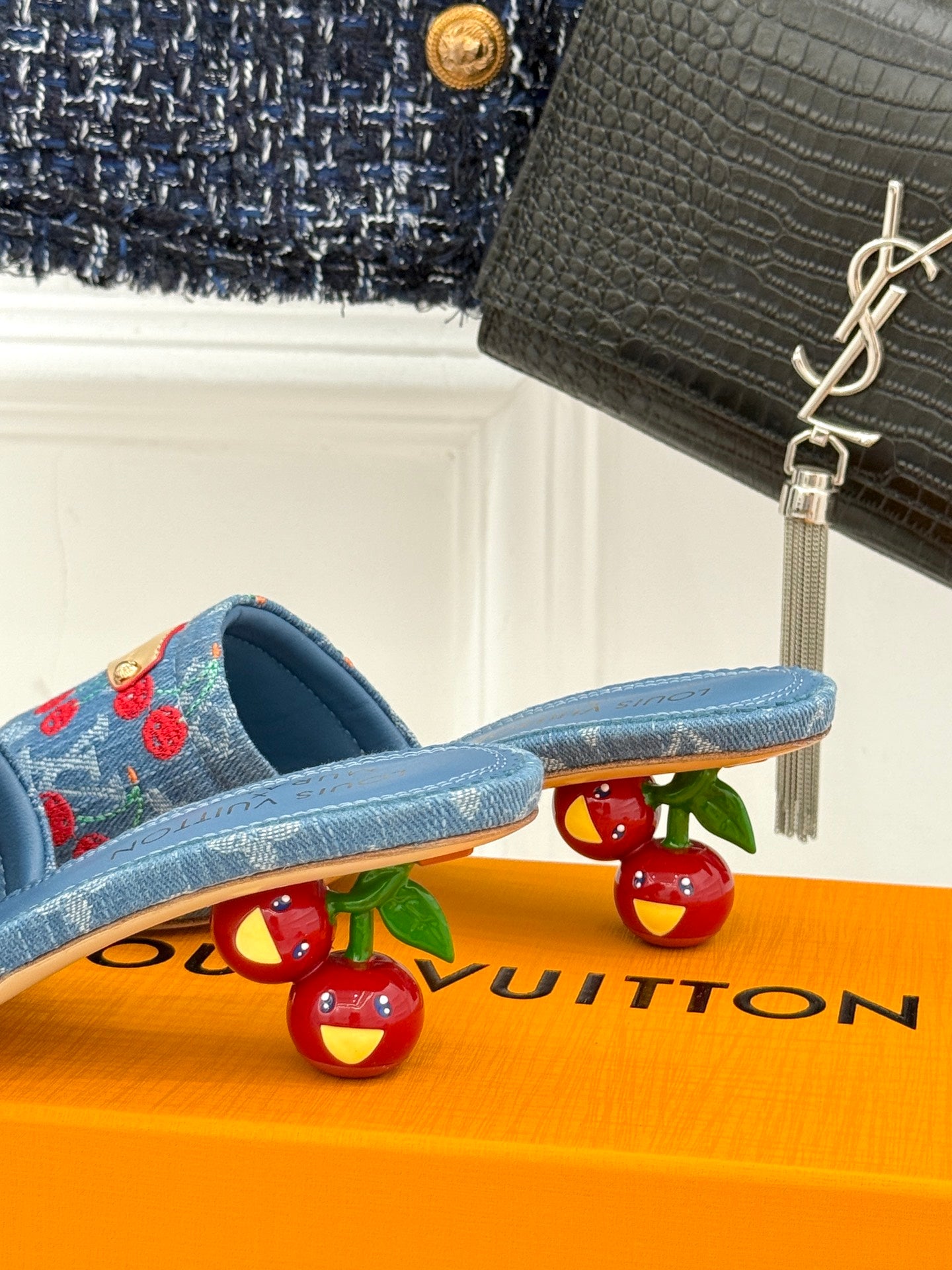 Louis Vuitton blue denim slide mules with red cherry detail and gold buckle straps