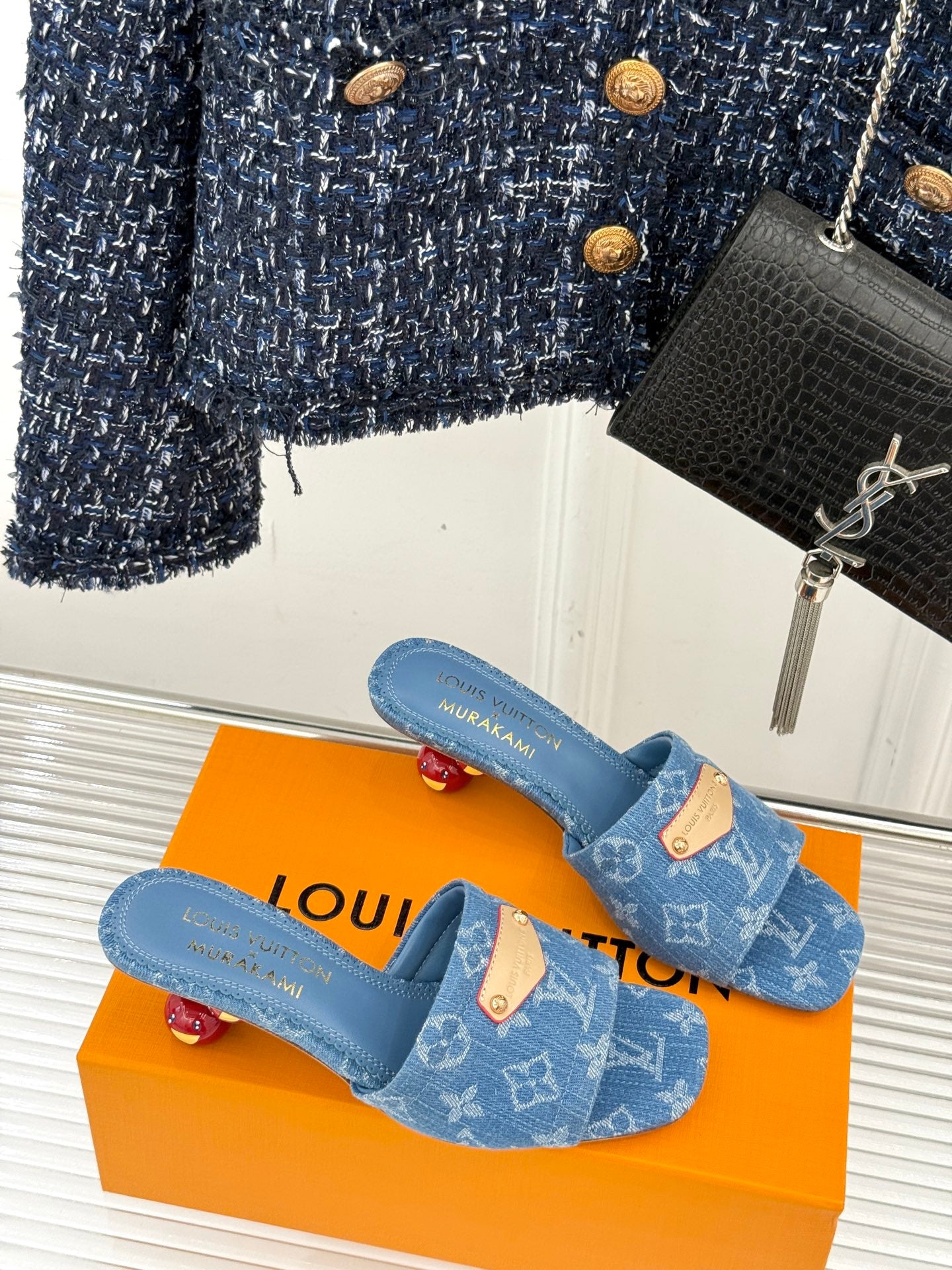 Blue Monogram slip-on sandals with tan buckle-look logo details