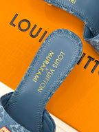 Close-up of blue Monogram slide sandal footbed with brand lettering