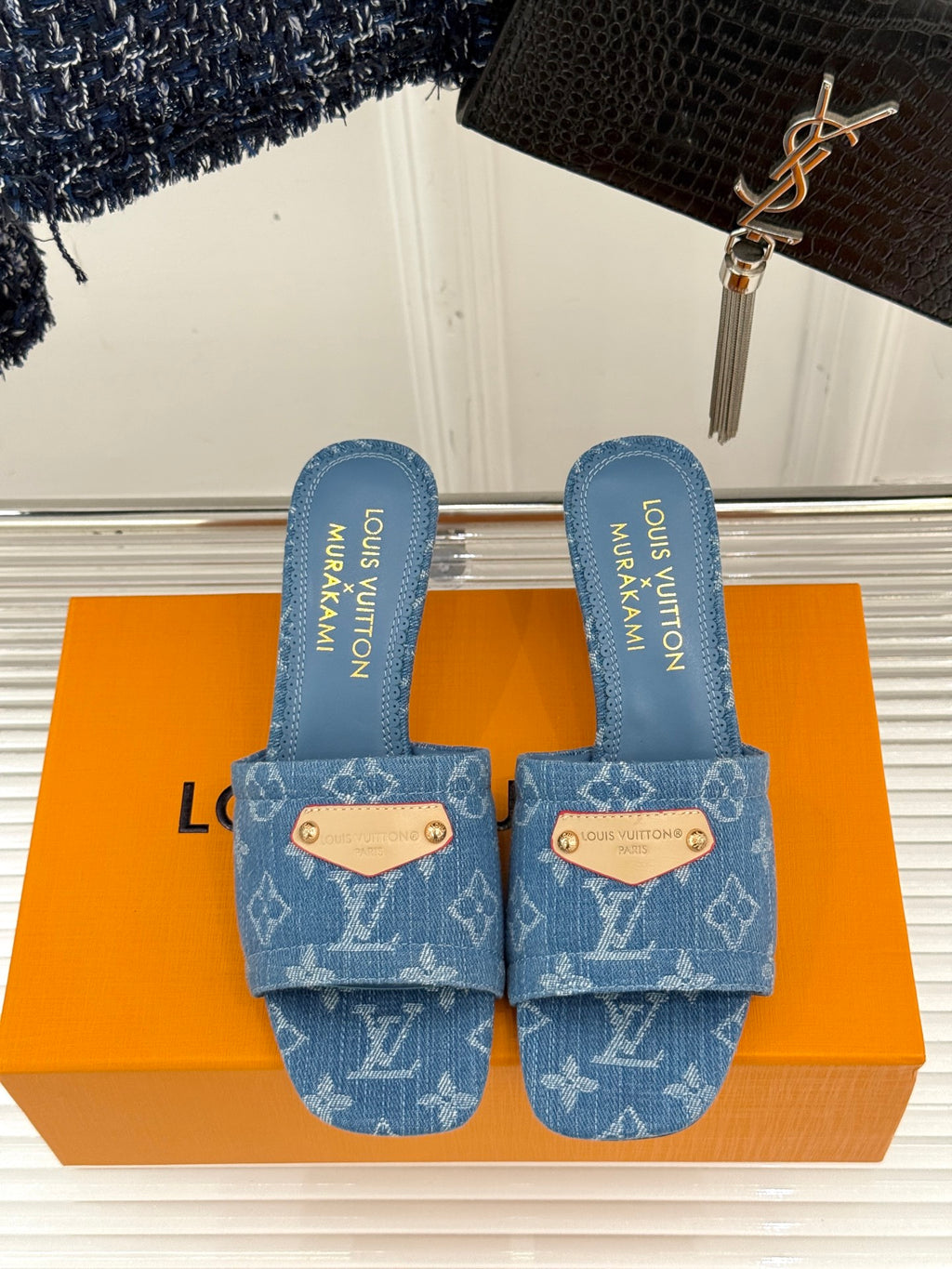 Blue Monogram slide sandals with two straps and branded blue insoles