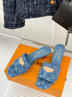 Blue Monogram slide sandals with tan logo tab straps and cushioned footbed